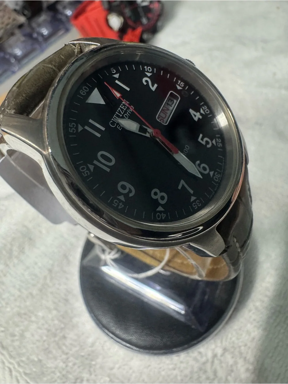 Citizen Men's Black Dial Watch with Red Second Hand and Brown Strap